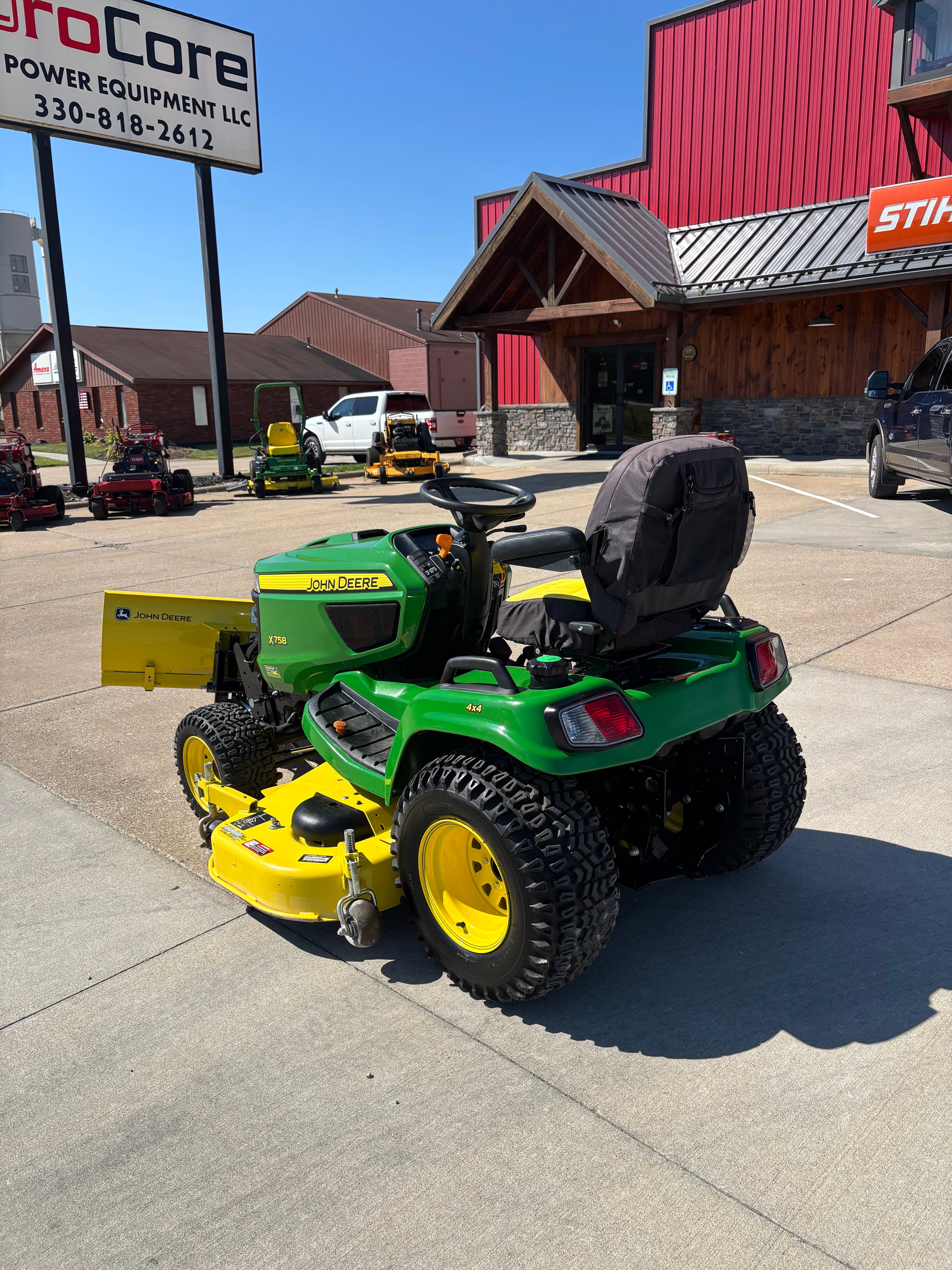 Used John Deere X758 four-wheel drive tractor