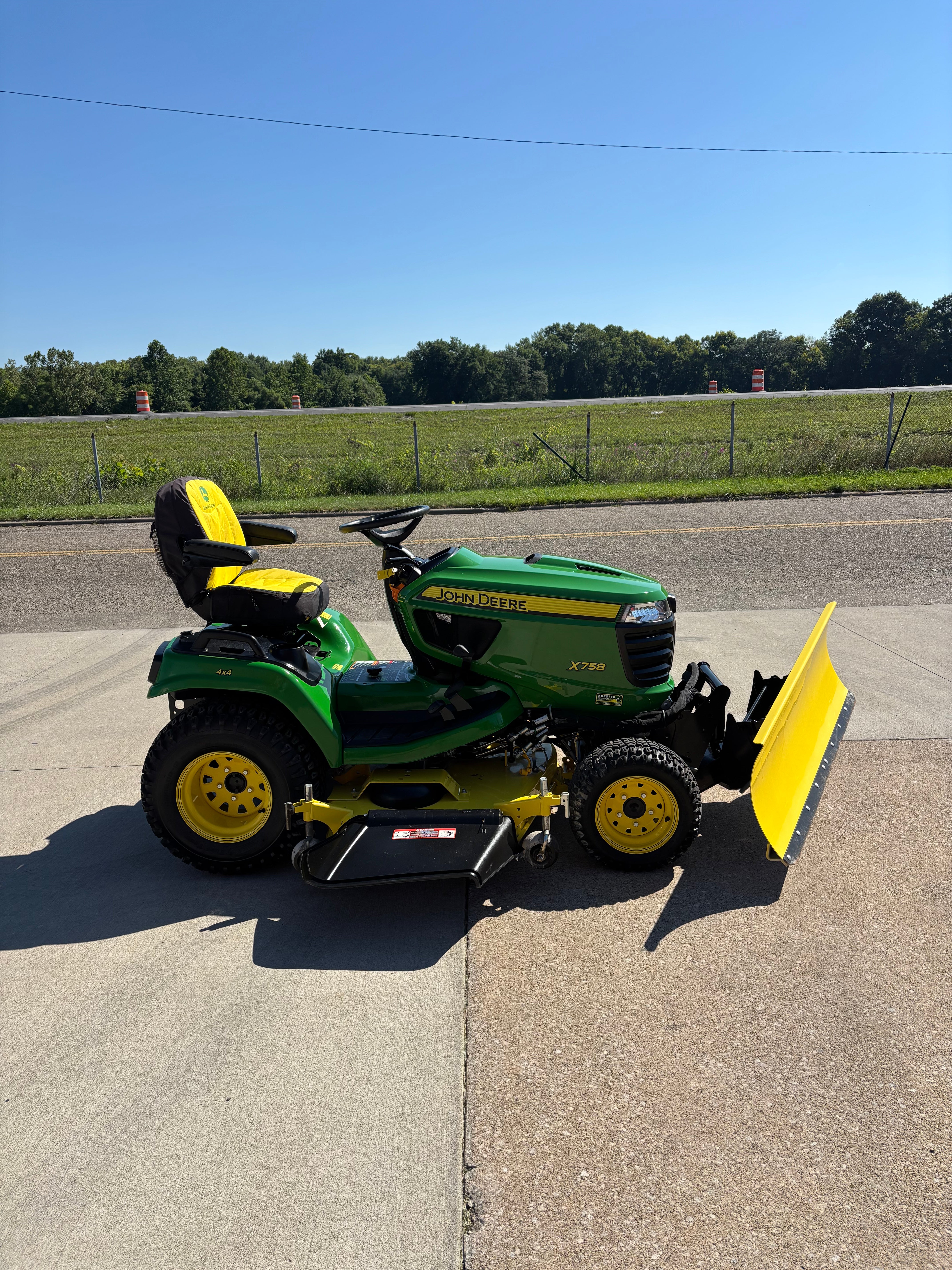 Used John Deere X758 four-wheel drive tractor