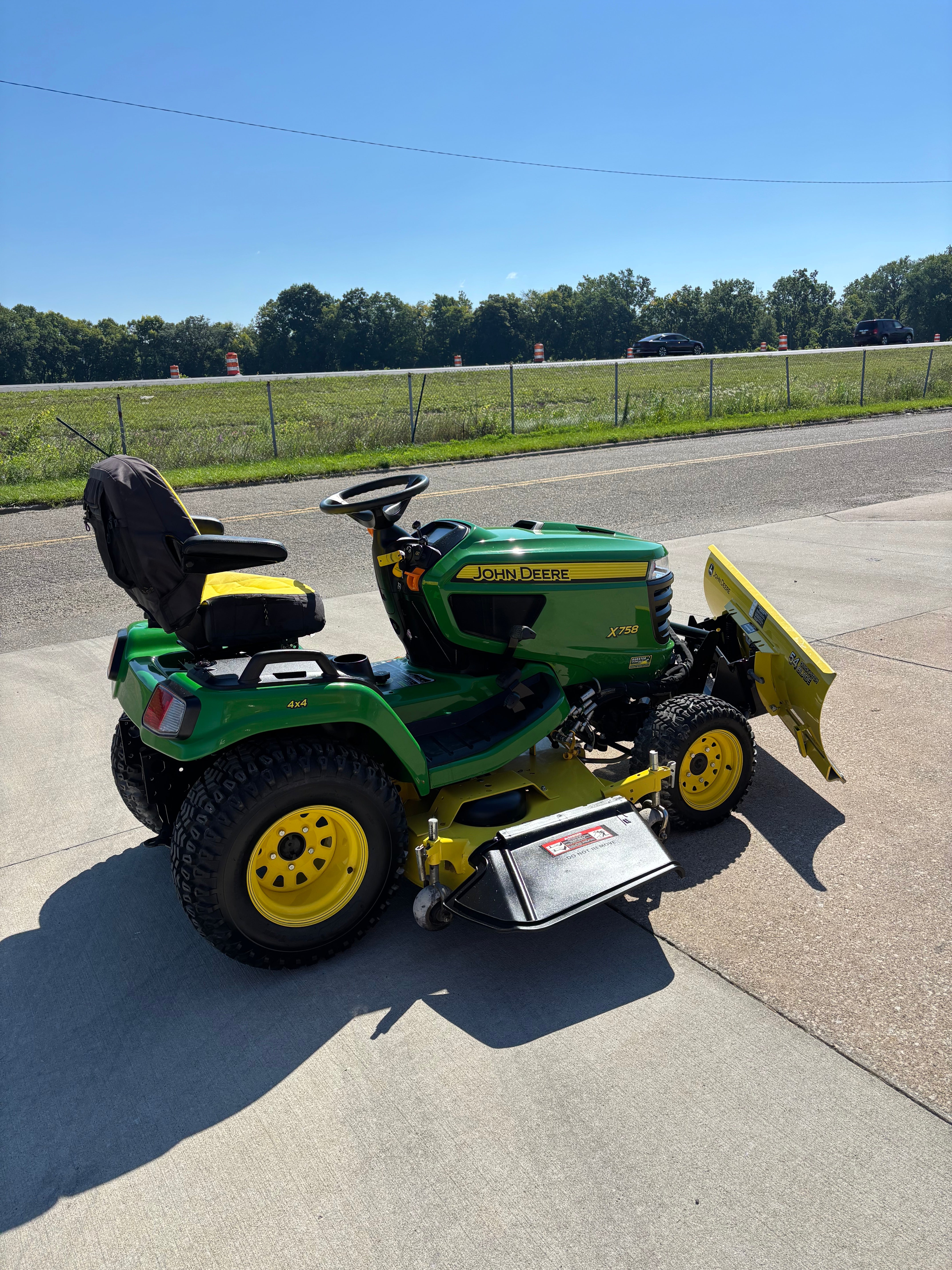 Used John Deere X758 four-wheel drive tractor