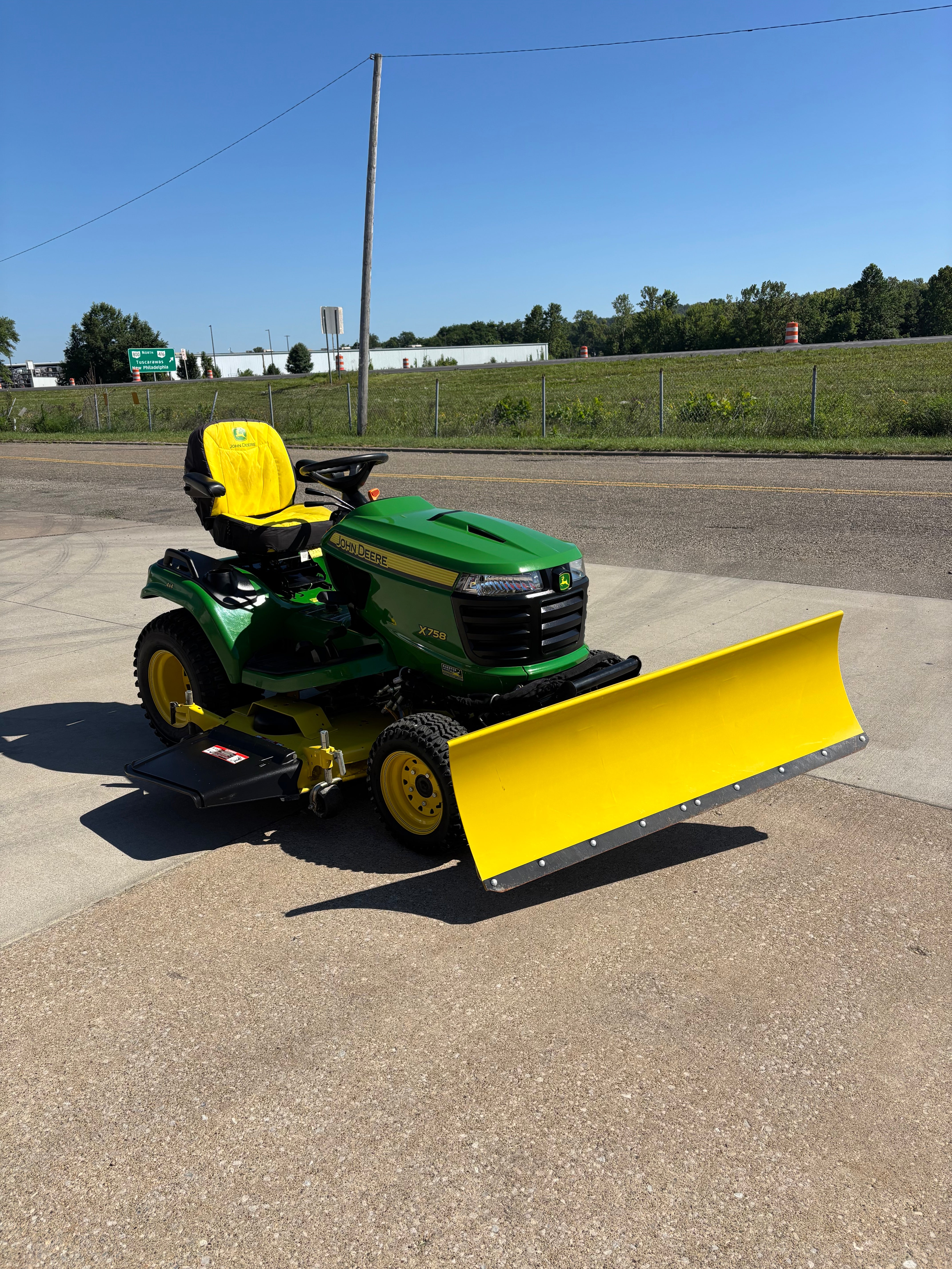 Used John Deere X758 four-wheel drive tractor