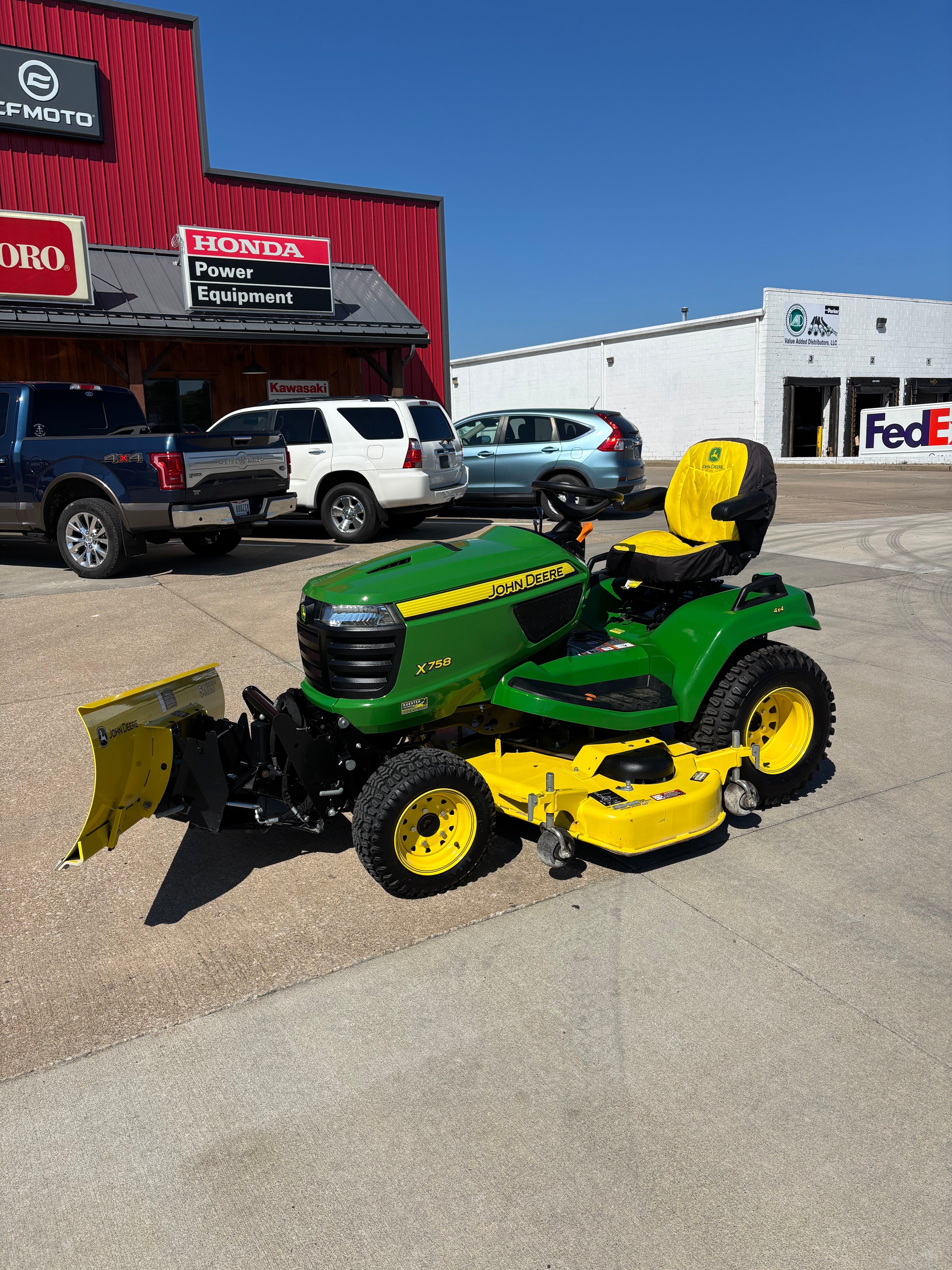 Used John Deere X758 four-wheel drive tractor