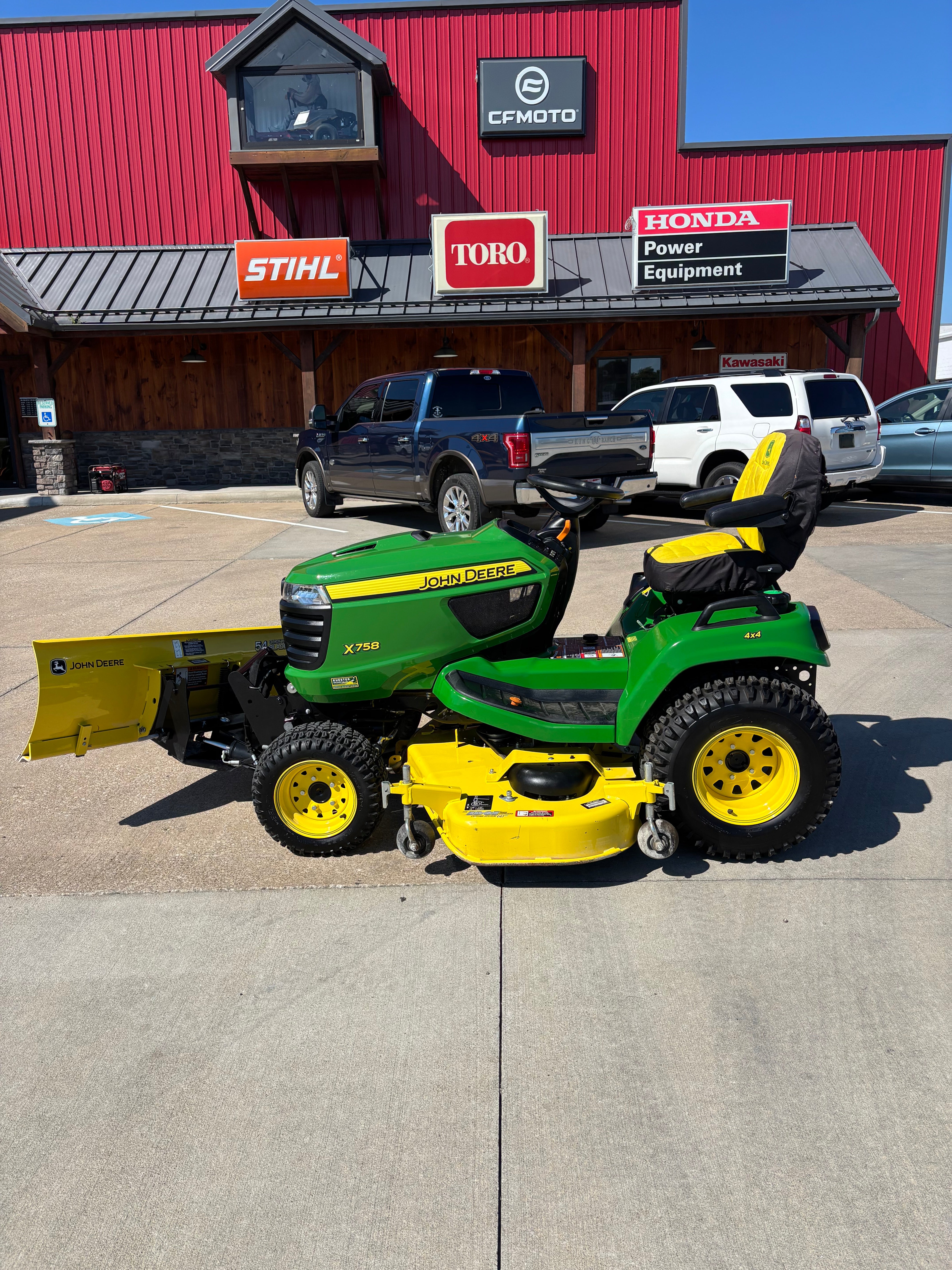 Used John Deere X758 four-wheel drive tractor