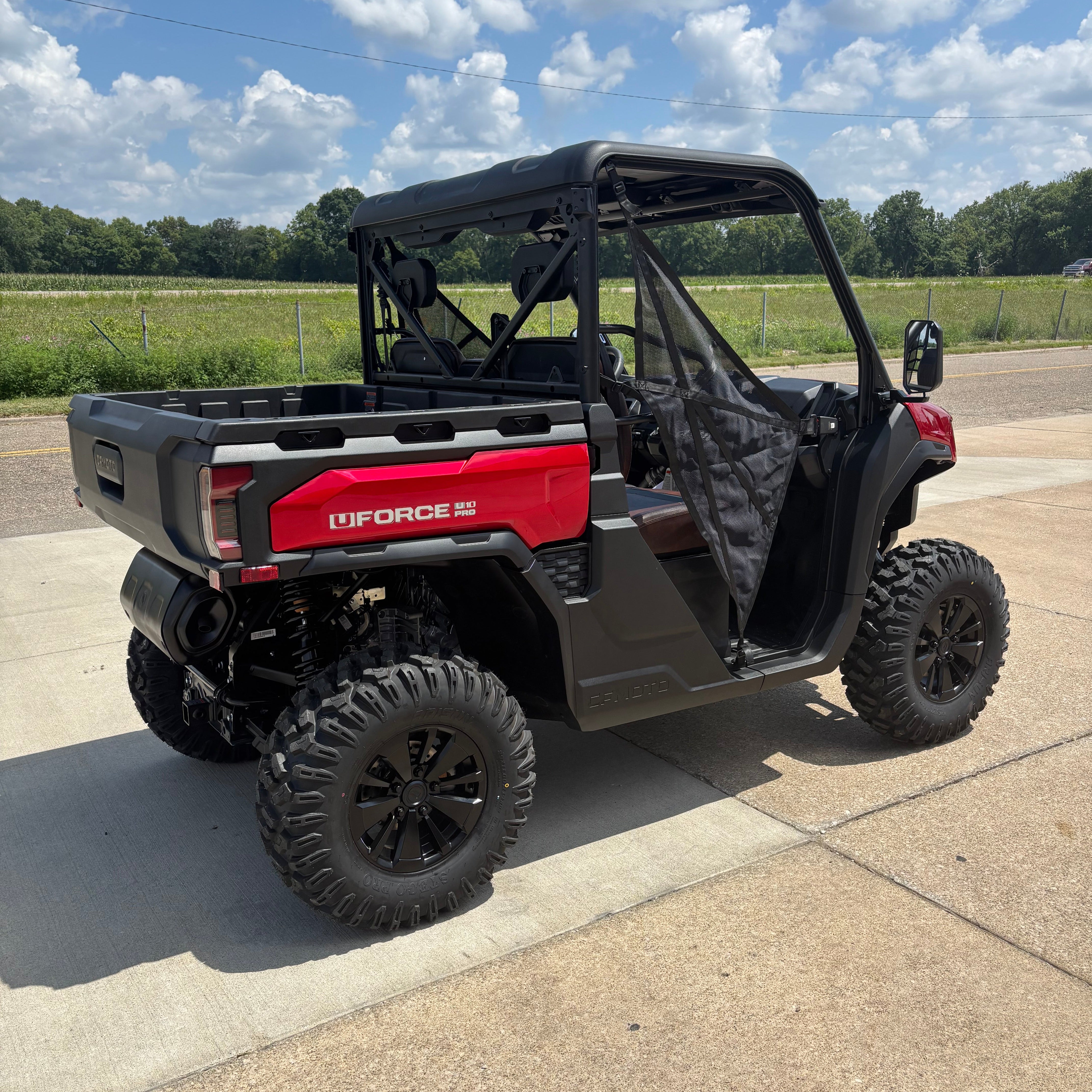 Cfmoto side by side in a parking lot on a sunny day